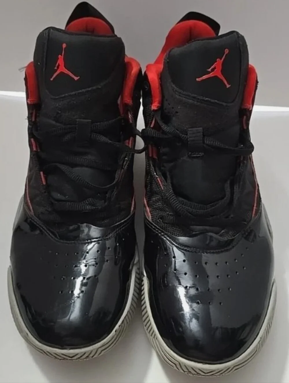 -- Air Jordan Men’s Black and Red High-Top Sneakers Size 11.5